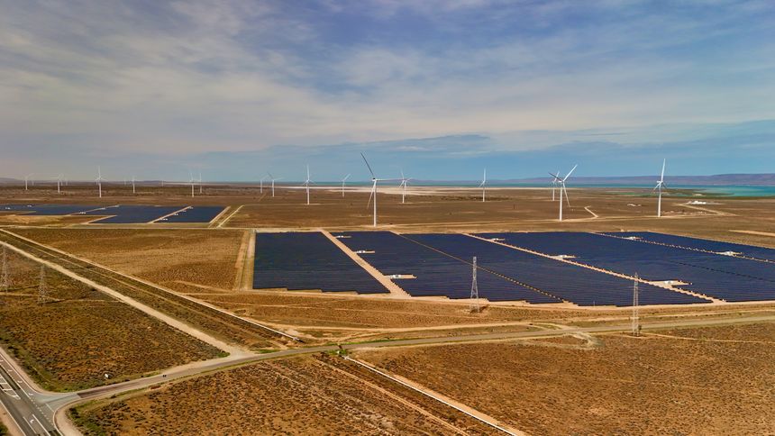 This aerial drone image captures the renewable energy hub at Port Paterson, South Australia, showcasing vast solar panel arrays and towering wind turbines set against the arid desert plains near the Spencer Gulf coastline. The footage highlights Australia’s commitment to sustainable power generation through solar and wind energy integration in one of the country’s most significant renewable energy corridors near Port Augusta.