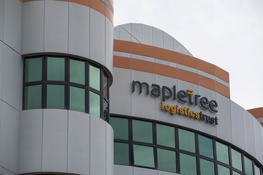 Singapore, 9 Dec 2023: Exterior of a modern industrial warehouse facility belonging to Mapletree Logistics Trust in Singapore. High-quality logistics infrastructure for supply chain and e-commerce distribution