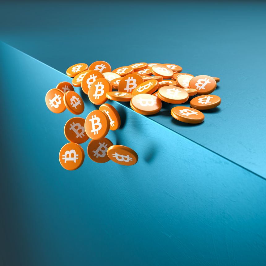 Crash of Bitcoin concept: Coin like cylinders with the bitcoin logo falling over the edge of a cube.