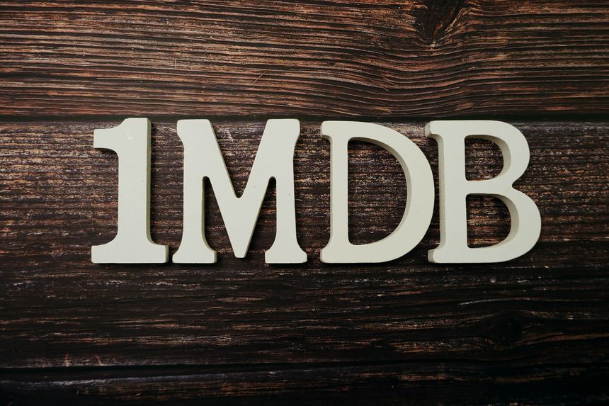1MDB alphabet letter on wooden background