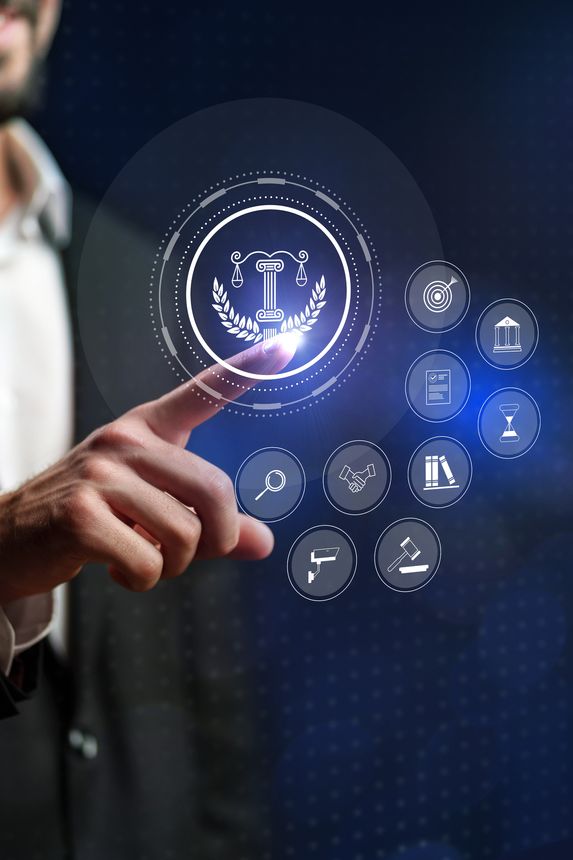 A business professional engages with a sleek interface displaying legal icons and symbols.