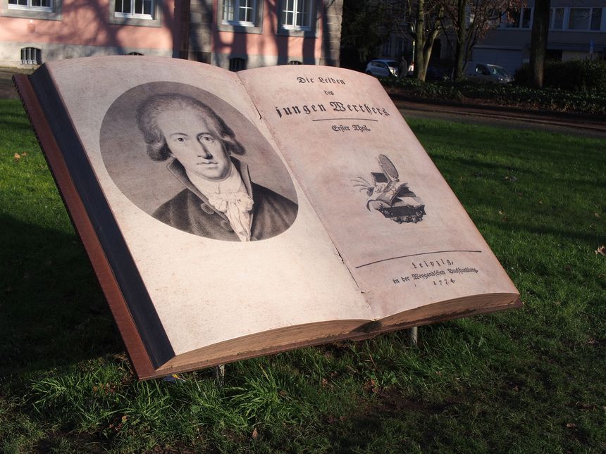 Large mock- up of The Sorrows of Young Werther (Die Leiden des jungen Werthers) by Johann Wolfgang von Goethe in front of the Goethe Museum in Düsseldorf, Germany.
The 1774 novel, written by a young Goethe is an important part of the German literature period known as Sturm und Drang, though Goethe distanced himself later from it.