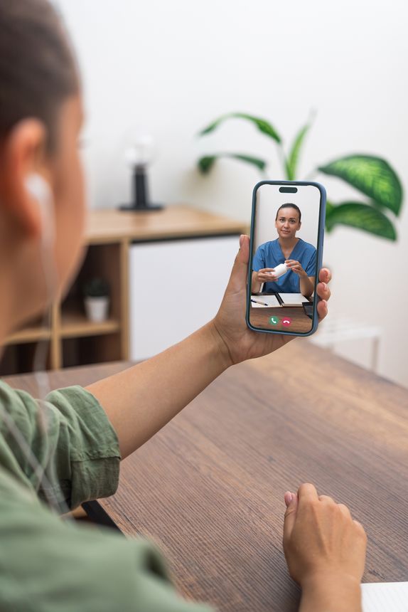 Patient engaging with a healthcare professional via mobile telemedicine service, exemplifying modern remote medical consultations.