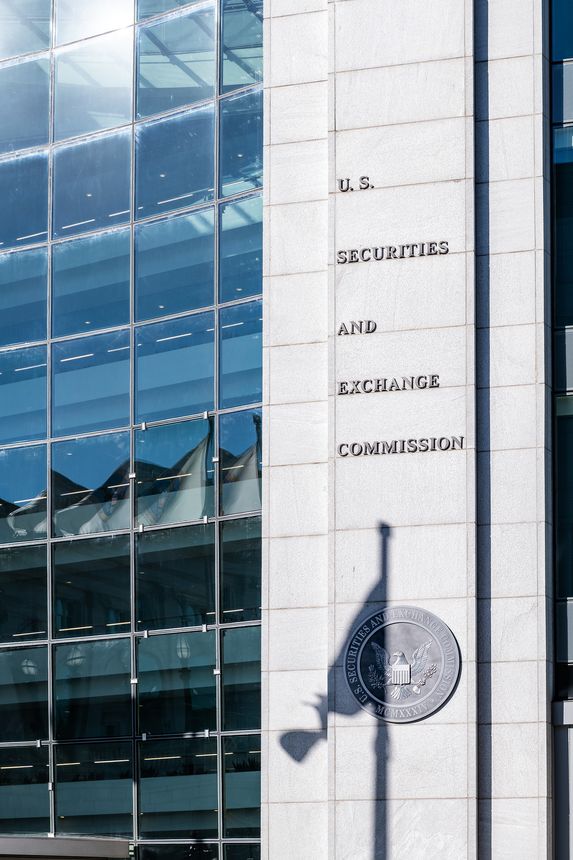 Washington DC, USA - October 12, 2018: US United States Securities and Exchange Commission SEC architecture closeup with modern building sign and logo with flag shadow by glass windows
