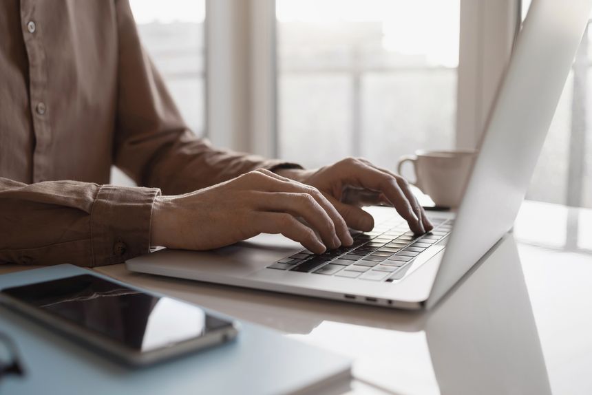 Young man working on laptop computer. Work from home, manager, internet marketing, freelance, student lifestyle, entrepreneur, business, employee concept