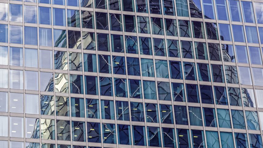 Modern buildings in London reflecting one another