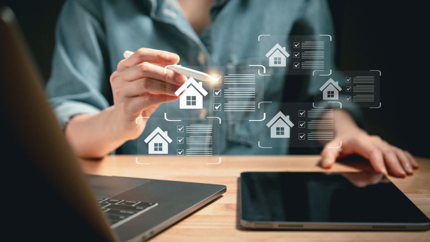 Close-up of individual using stylus to interact with virtual housing checklists on screen symbolizing real estate choice and digital property search
