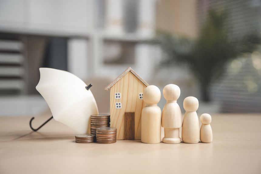 home, insurance, coverage, property, risk, policy, deductible, A wooden house, family figures, coins, and an umbrella symbolize home insurance, financial protection, and family security.