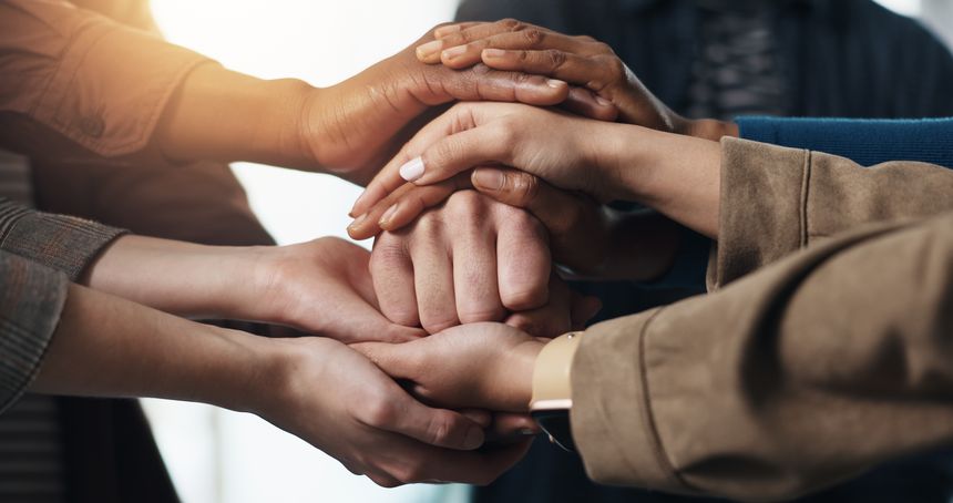 Business people, hands together or meeting with team for social cohesion or inclusion in office. Closeup, employees or pile with stack in huddle, diversity or solidarity for trust, support or mission