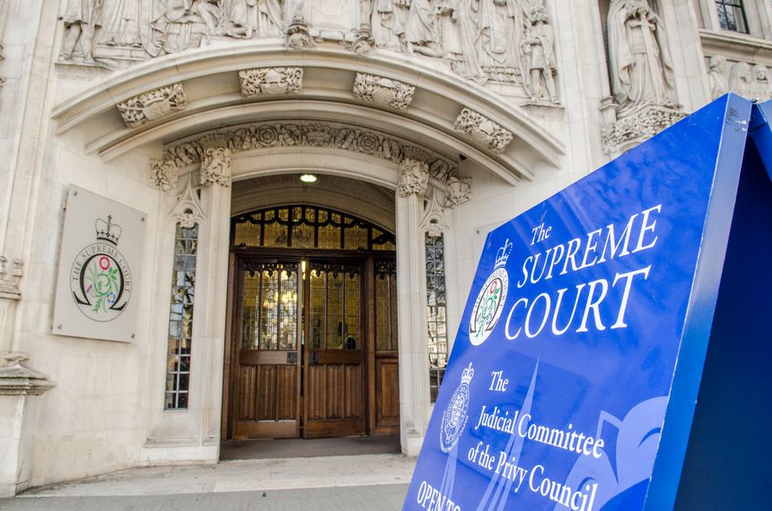 Exterior signage and entrance to the highest court in British Law.