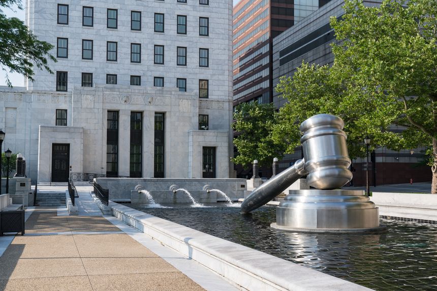 COLUMBUS, OH - JUNE 17, 2018: Stainless steel gavel sculpture created by Andrew Scott located in the courtyard of the Ohio Judicial Center in downtown Columbus, Ohio