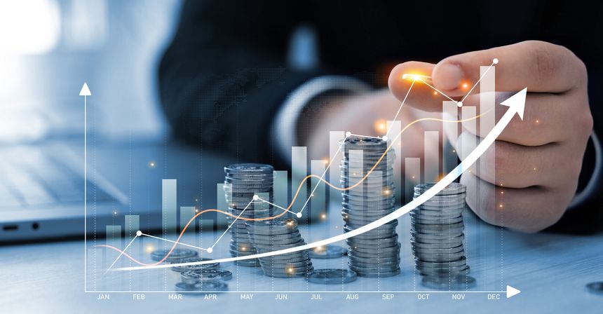 Businessman hand putting money coin stack with growing business graph. Saving money concept. Financial growth data or investment market profit bar and success report.