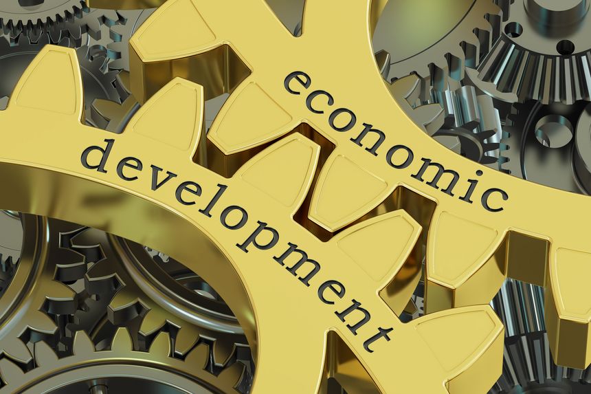 Economic Development concept on the gearwheels, 3D rendering