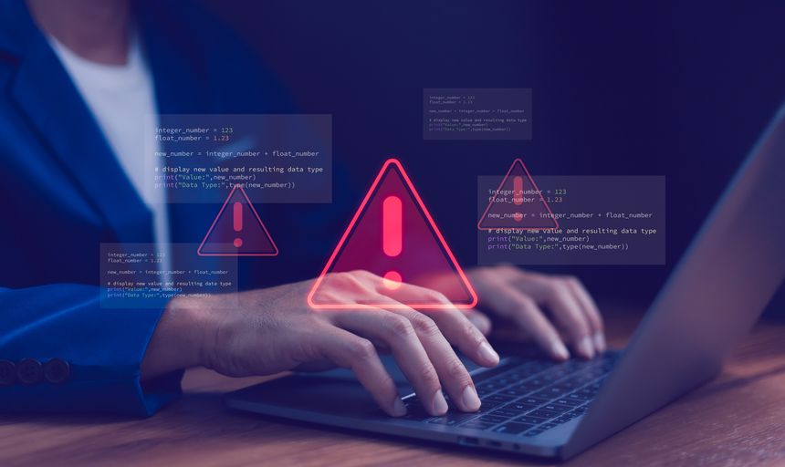 Cybersecurity warning concept. Warning icon and programming code. Data breach, system error, hacking attempt, software development issues and bug fixing process. Cyber security and IT support.
