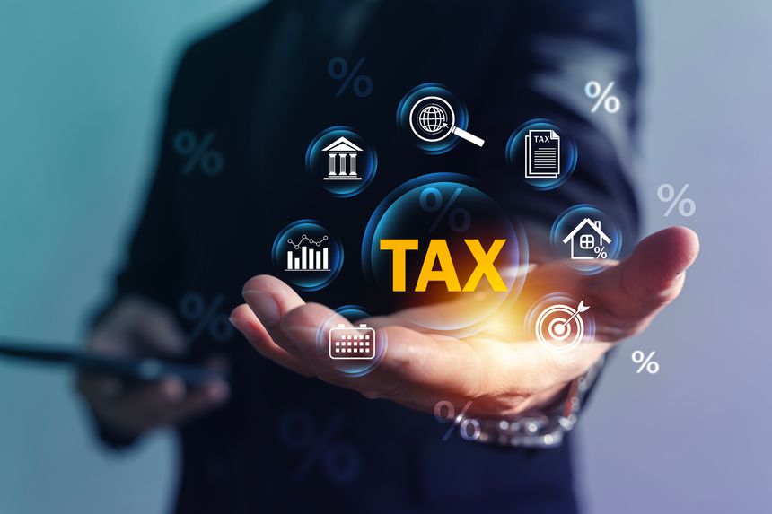 Businessman holding TAX symbol with finance icons, percentages and calendar. Concept of tax planning, filing deadline, audit, accounting, compliance, deductions and financial reporting.