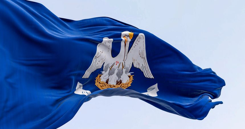 Louisiana state flag waving on a clear day. Mother pelican in a blue area with the slogan of the state. US state flag. 3d illustration render. Fluttering fabric. Selective focus