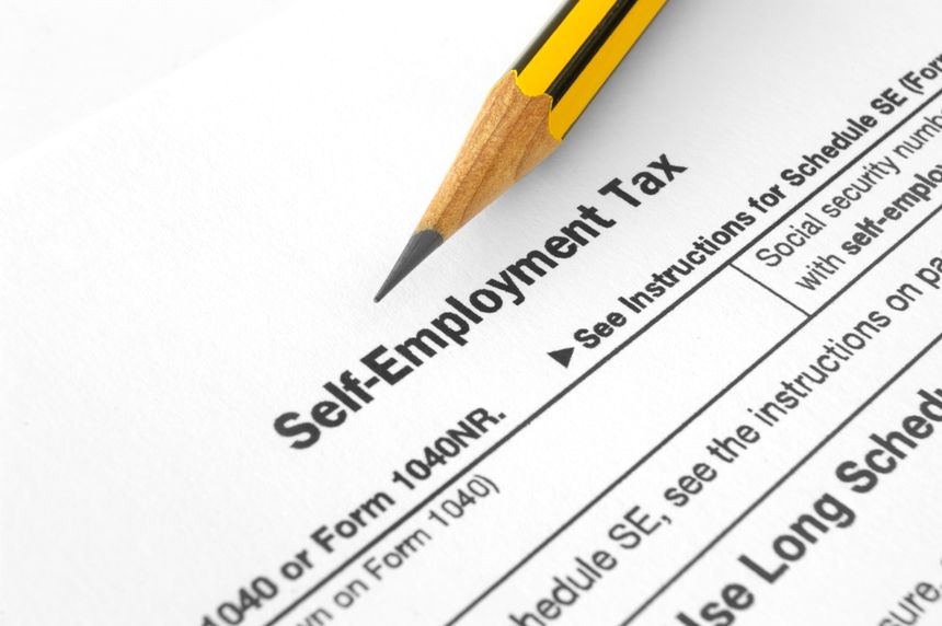 Close-up of Self-Employment Tax with pencil on it