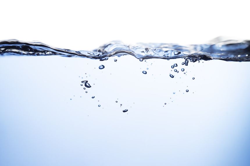 Air Bubbles Float Up Underwater. Water Splashing, Pure Drinking Water, Oxygen Relaxation. Blue Water Textured on White Background.