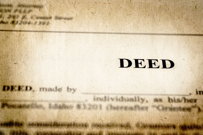 Vintage Deed to real estate transfer title ownership to land or home old weathered paper