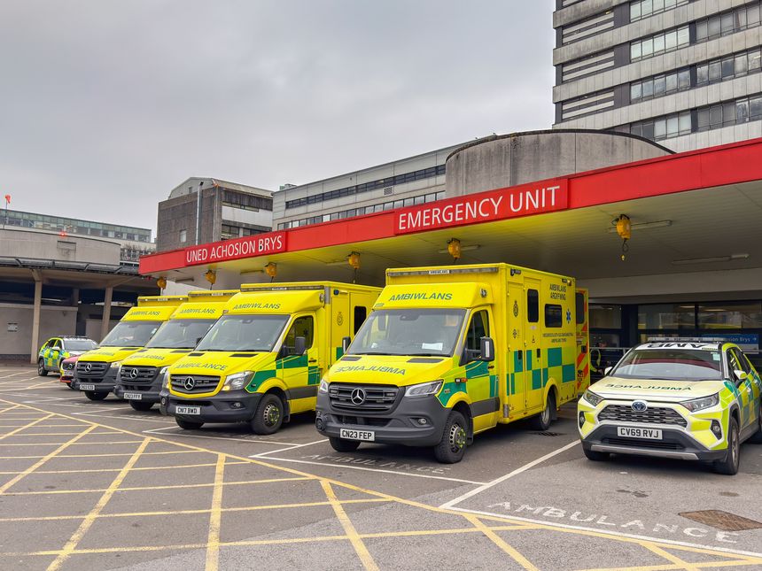 Cardiff, Wales, UK - 17 February 2025: Ambulances waiting outside the accident and emergency department of The Heath Hospital near Cardiff city centre.