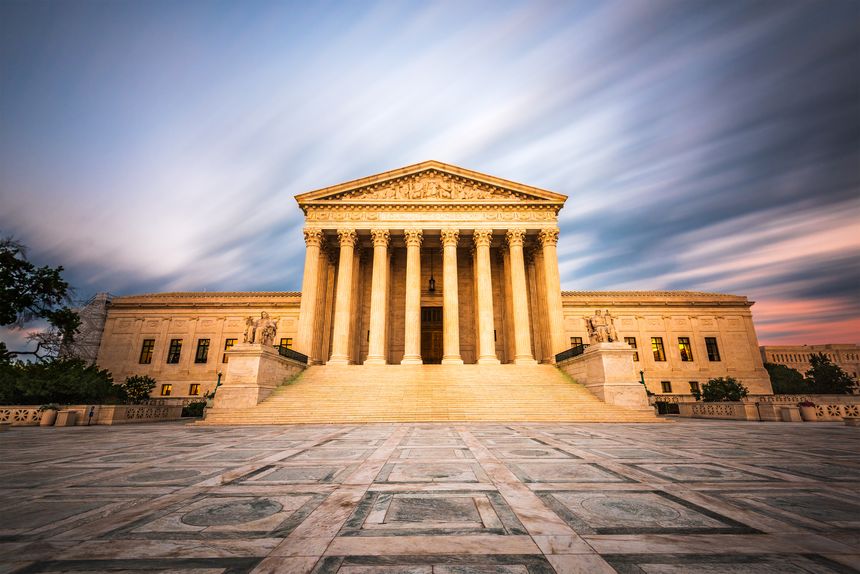 United States Supreme Court Building in Washington DC, USA at dusk.