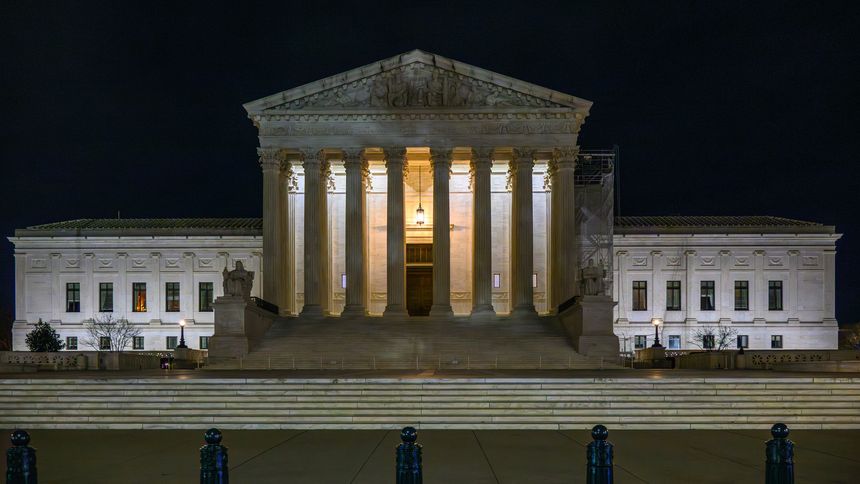 The Supreme Court building in Washington DC illuminated at night. The Supreme Court of the United States is the highest court in the federal judiciary of the United States of America.