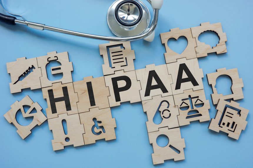 Stethoscope and medical puzzles with HIPAA Health Insurance Portability and Accountability Act.