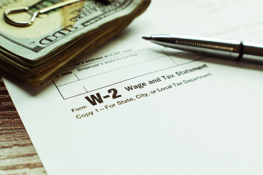 W-2 Tax Form With Expensive Pen & Money