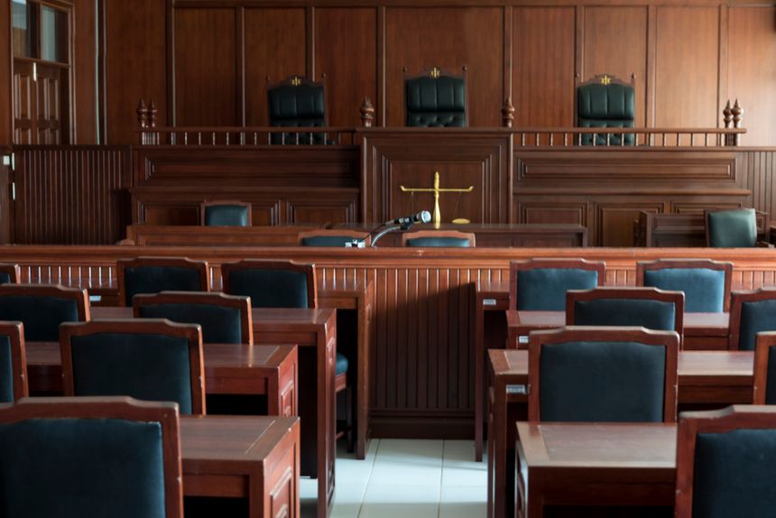Empty Chairs And Tables In Courtroom
