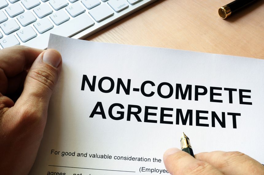 Man is signing Non compete agreement