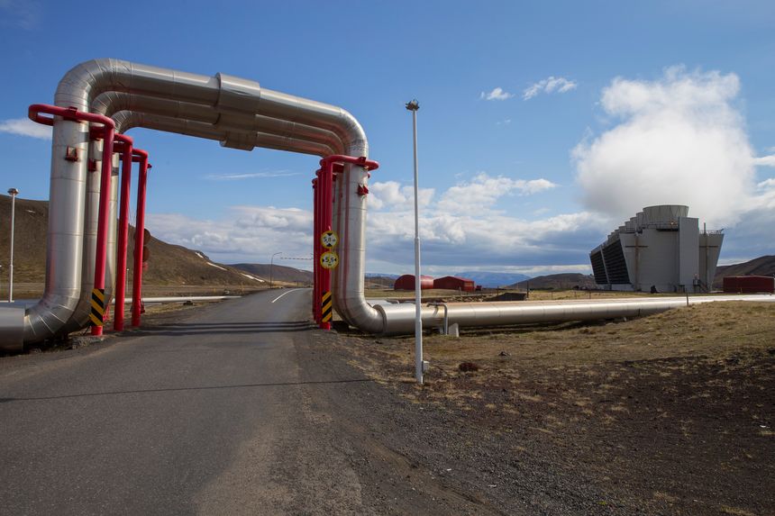 Road under Krafla geothermal power station's pipes in Iceland