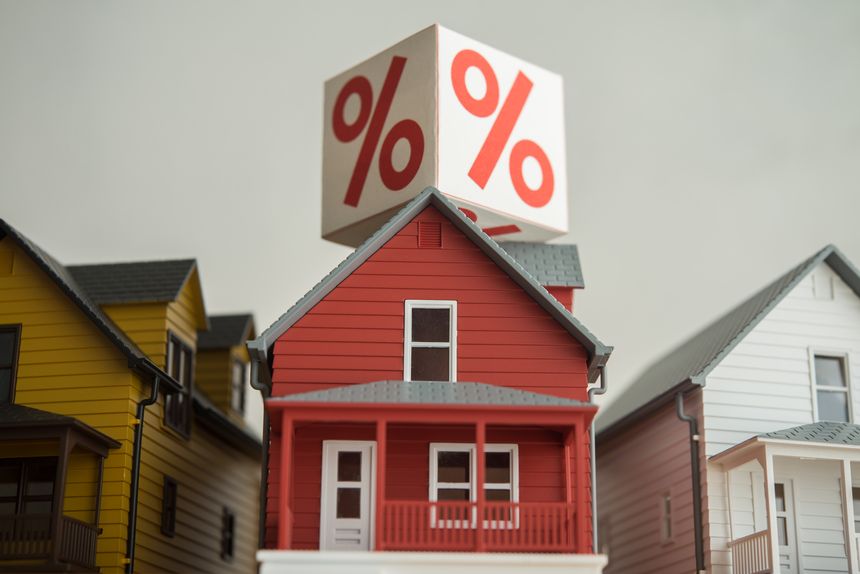 Interest rate (percentage sign) on houses. Mortgage loan, burden payment from high interest rate, FED central bank control monetary policy, financial risk management, construction industrial concept.