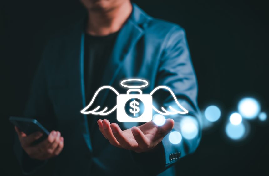 Angel investor concept. Businessman holding money bag icon with wing