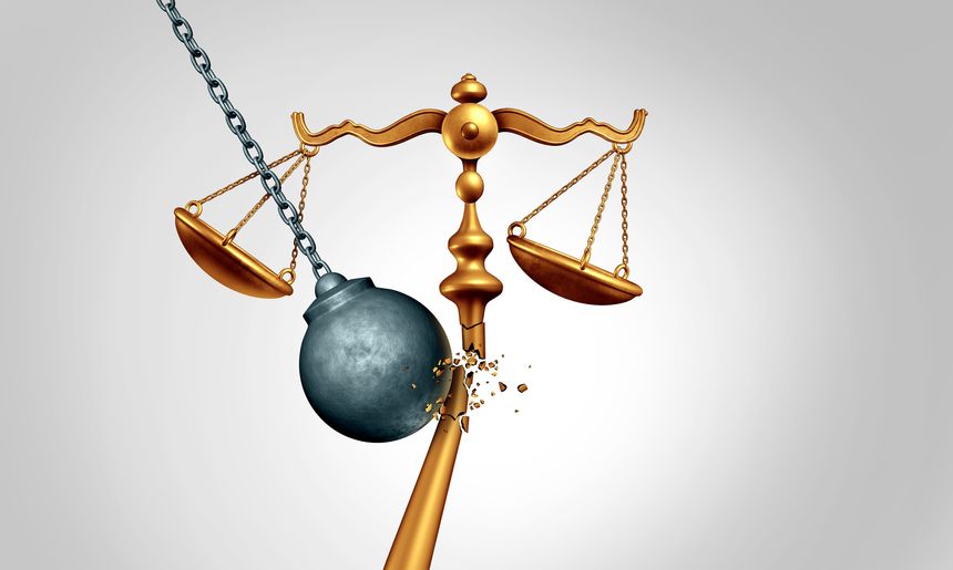 A symbolic jurisprudence image of justice unraveling and consequences of breaking the law or not following laws causing unrest and unlawful behavior or broken contract business symbol.