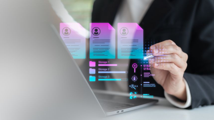 Businesswoman using a laptop with digital HR management, resume database, and cloud storage technology, concept of recruitment, job application, and workforce analytics.