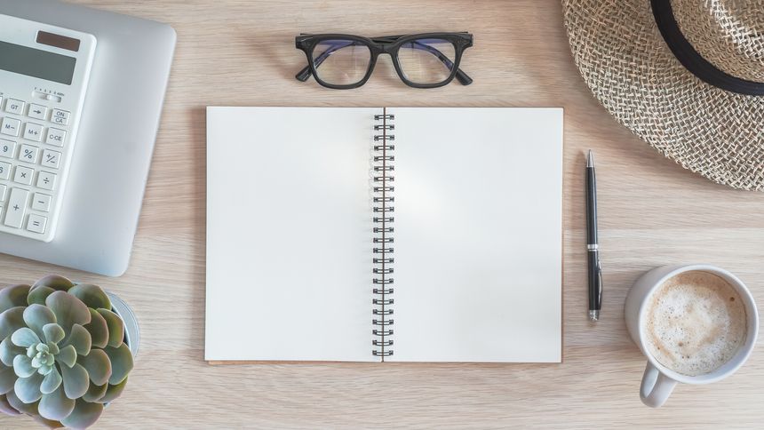 Notebook mock up open blank note book paper page copy space mockup template on work desk workspace from top view with computer laptop, calculator for office business memo and home accounting planner