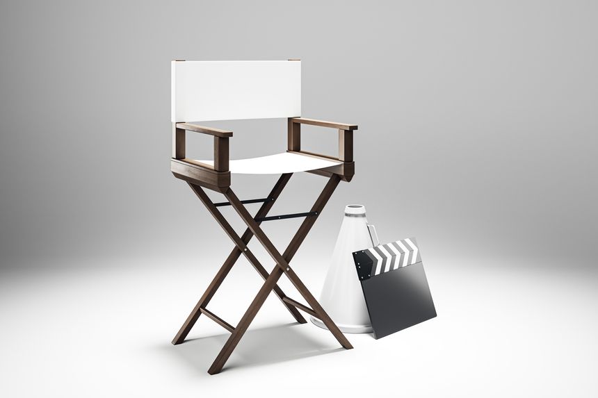 Director's chair, clapperboard, megaphone on a white background. Cinematic tools concept. 3D Rendering