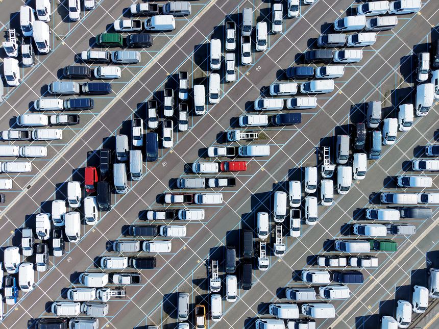 Car parking at the port. Delivery of cars by ship. Cars background. Car parking.