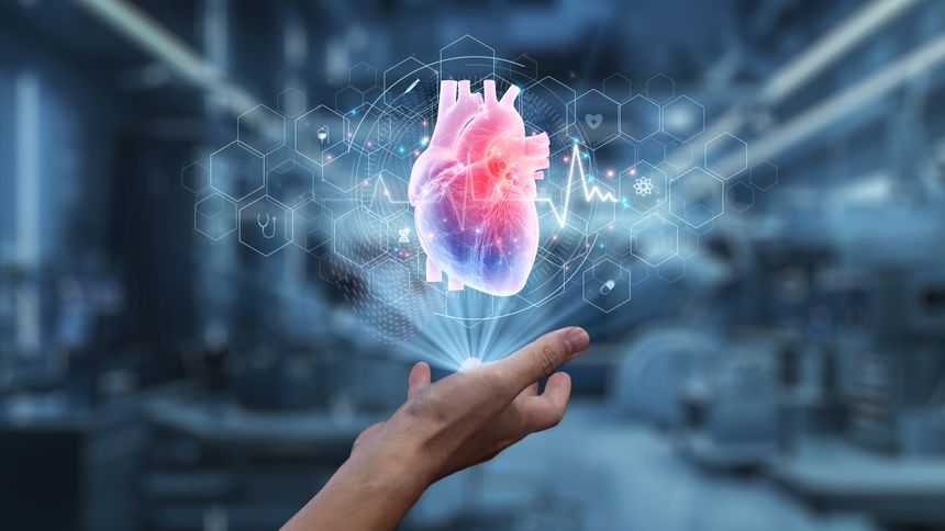 Close up of human hand holding heart holographic floating at laboratory background. Human hand accessing and connecting medical data by using heart icon to analyzing and diagnosis symptom. Salubrious.