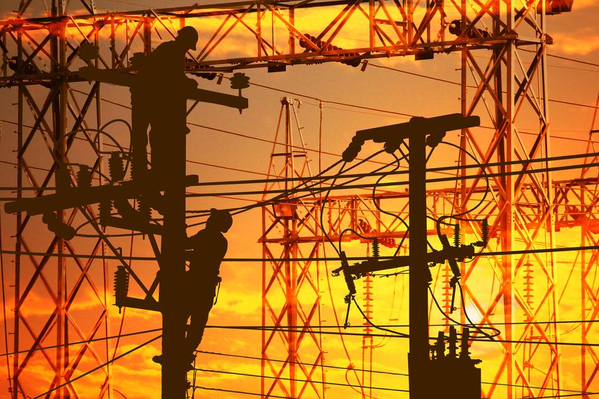 silhouette electric worker work late on electric power supply station