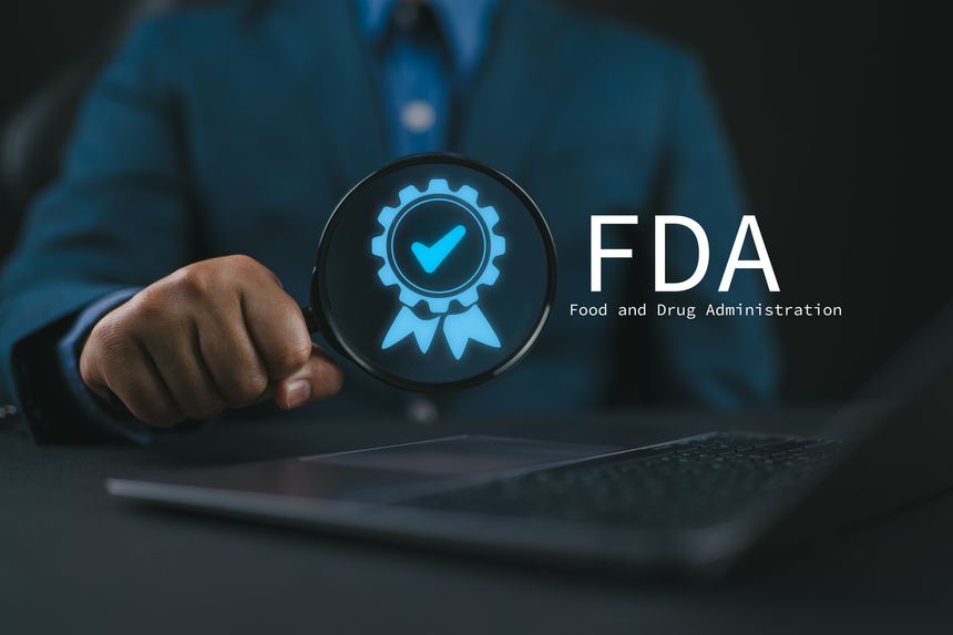FDA Approved Food and Drug Administration concept. Person using laptop with FDA icon on virtual screen for Health product standards control system.