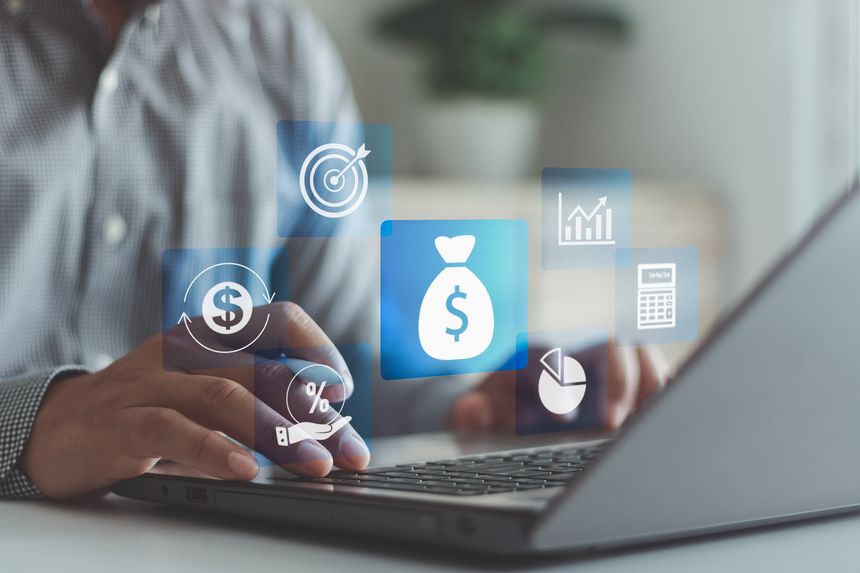Businessman using laptop with digital icons of money, charts, financial growth, online banking, digital finance, investment management and business analytics for economic success and profit strategy.