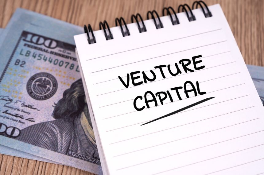 Financing concept. Venture capital written on notepad.