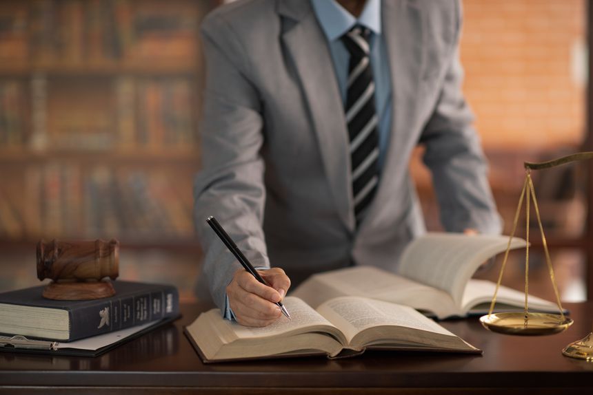 adviser Lawyer Study the law for lawsuit and legal system at law firm.