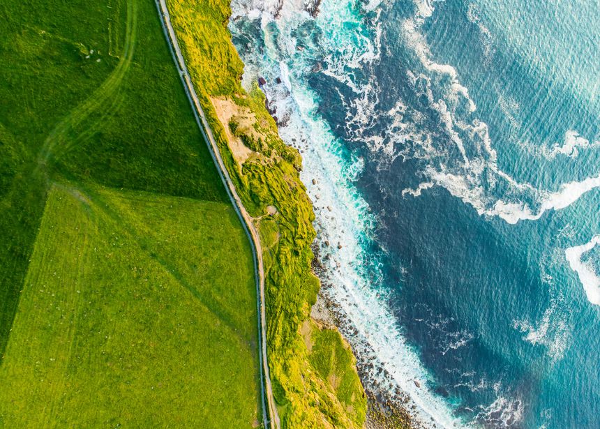 World famous Cliffs of Moher, one of the most popular tourist destinations in Ireland. Aerial view of widely known tourist attraction on Wild Atlantic Way in County Clare.