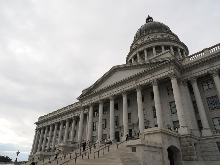 Salt Lake City, UT - September 20, 2025: Wide, low-angle view showing the expansive stone facade, columns, and sweeping staircase of the State Capitol.