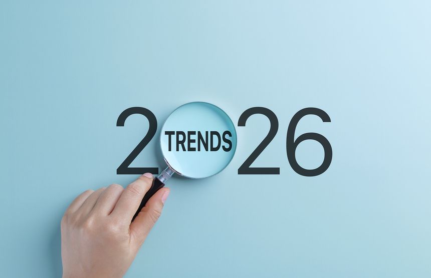 2026 Business Trends Concept. A hand holds magnifying glass focusing on the word Trends within the year 2026, representing the concept of future business and marketing trends and seo planning.