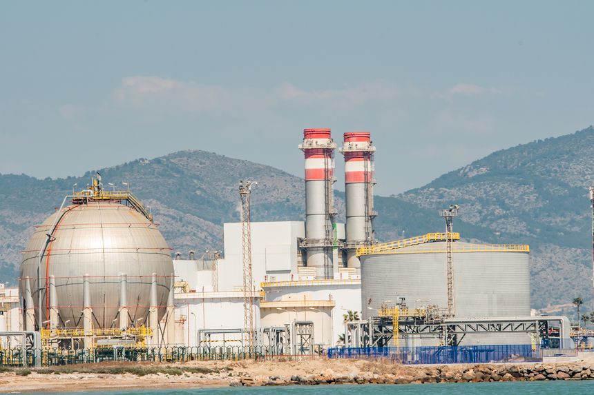 Oil storage tanks, pipes, and infrastructure on the territory of an oil refinery. An oil depot on the Mediterranean coast, rising fuel prices. The global oil market and shortage. The war in Iran.