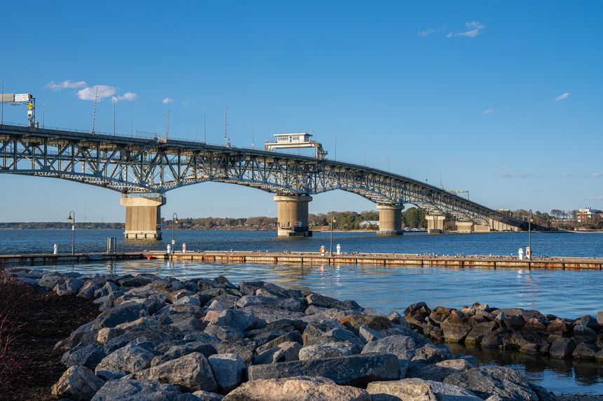 View of the Coleman Memorial Bridge spanning the York River on a clear day in Yorktown Virginia.