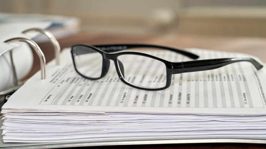 Glasses on a file folder in an office